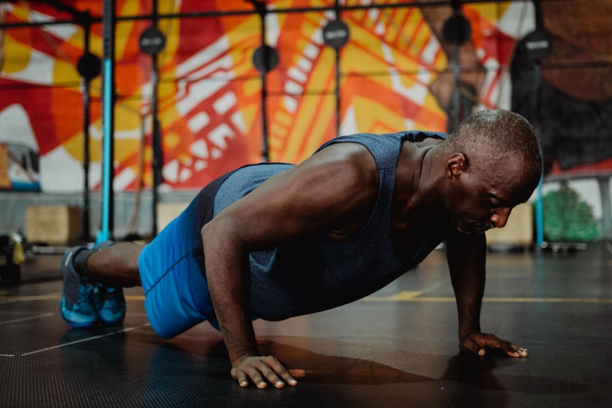 Athletic member doing push-ups during a strength workout