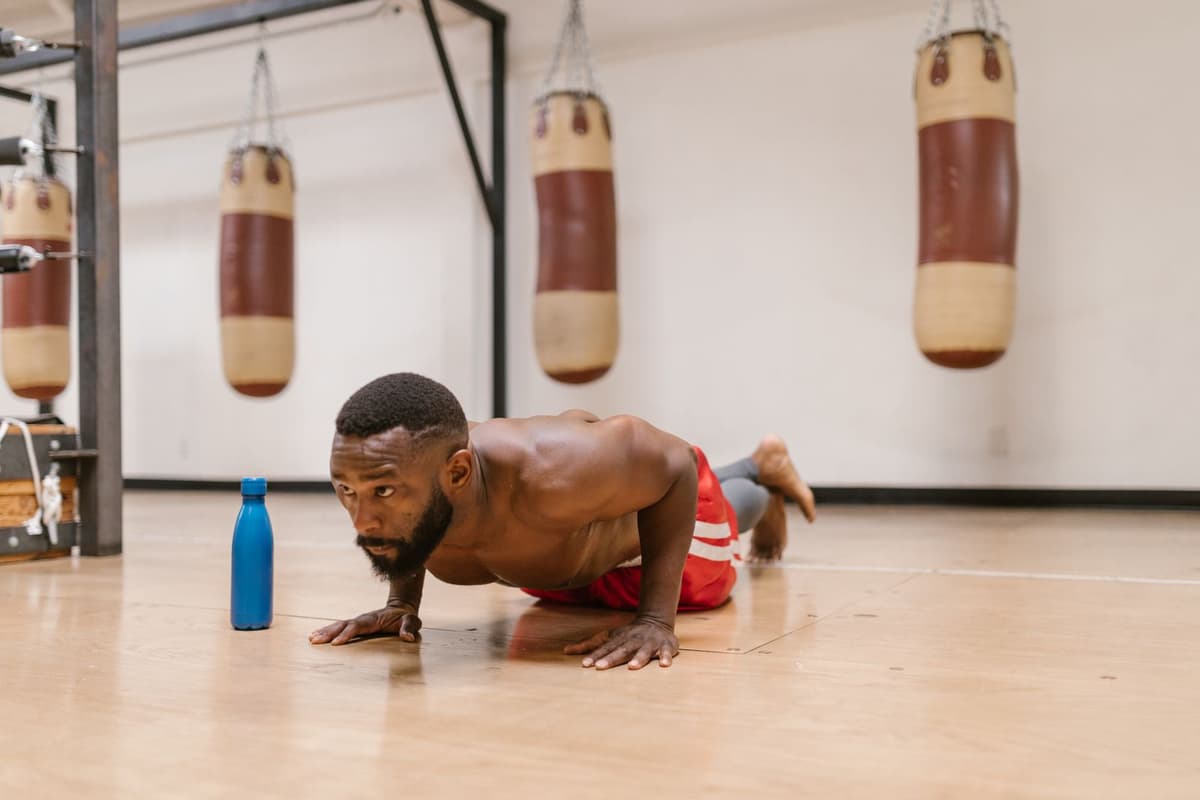 Member holding a push-up position during coached training